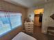 Comfortable bedroom with closet, wooden paneling, and natural light at 808 53Rd E Ave # 234, Bradenton, FL 34203