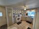 Functional kitchen featuring a white oven and plenty of cabinetry, and tiled flooring for easy maintenance at 808 53Rd E Ave # 234, Bradenton, FL 34203