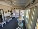 Well-lit sunroom featuring carpet floors, bright windows, and comfortable furniture at 808 53Rd E Ave # 234, Bradenton, FL 34203