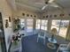 Bright sunroom featuring a ceiling fan, carpet flooring, and multiple windows offering lots of natural light at 808 53Rd E Ave # 234, Bradenton, FL 34203