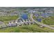 Aerial view of the community, highlighting its beautiful lakes, landscaping, and surrounding homes at 8722 Backshore Ln, Parrish, FL 34219