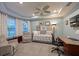 Sitting room includes a day bed, sitting chairs, and ceiling fan at 8722 Backshore Ln, Parrish, FL 34219