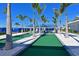 Bocce ball court surrounded by palm trees, offering a relaxing and social recreational activity at 8722 Backshore Ln, Parrish, FL 34219