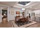 Cozy dining room with wood flooring, elegant furnishings, and plenty of natural light at 8722 Backshore Ln, Parrish, FL 34219