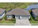 Beautiful home featuring a well-manicured front lawn and a paver driveway at 8722 Backshore Ln, Parrish, FL 34219