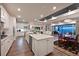 Spacious eat-in kitchen with a large center island, stainless steel appliances, and wood floors at 8722 Backshore Ln, Parrish, FL 34219