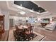 Open-concept living area with views of the kitchen and dining room, perfect for entertaining at 8722 Backshore Ln, Parrish, FL 34219