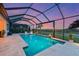 Relaxing pool featuring a screen enclosure, and manicured landscaping at 8722 Backshore Ln, Parrish, FL 34219