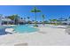 Beautiful pool with clear water, a gradual entry, and lush landscaping offers a resort-like experience at 8722 Backshore Ln, Parrish, FL 34219