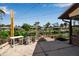 Spacious backyard concrete patio and canal view at 9011 Hilolo Ln, Venice, FL 34293