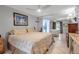 Spacious bedroom with mirrored wall and partial view into a bathroom at 9011 Hilolo Ln, Venice, FL 34293