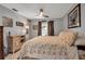 Cozy bedroom featuring a window and side door at 9011 Hilolo Ln, Venice, FL 34293