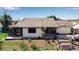 Aerial view of house with screen patio, back yard and deck overlooking canal at 9011 Hilolo Ln, Venice, FL 34293