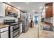 Spacious kitchen with stainless steel appliances, ample counter space, and modern fixtures at 9011 Hilolo Ln, Venice, FL 34293