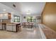 Open concept kitchen and dining area with stainless steel appliances, ample counter space, and natural lighting at 9011 Hilolo Ln, Venice, FL 34293