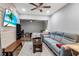 Cozy living room featuring a comfortable sofa and a flat screen TV at 9011 Hilolo Ln, Venice, FL 34293