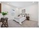 Cozy bedroom with neutral carpet, natural light, and contemporary decor at 9035 Duany Ln, Lakewood Ranch, FL 34240