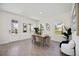 Open concept dining area with lots of natural light and wood floors at 9035 Duany Ln, Lakewood Ranch, FL 34240