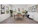 Elegant dining room with bright light, wood floors, and stylish decor at 9035 Duany Ln, Lakewood Ranch, FL 34240