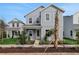 Charming two-story home featuring a well-maintained front yard with lush landscaping at 9035 Duany Ln, Lakewood Ranch, FL 34240