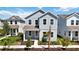 Charming two-story home featuring a well-manicured front lawn and a welcoming porch at 9035 Duany Ln, Lakewood Ranch, FL 34240