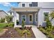 Welcoming porch area with decorative plants and house number above the door at 9035 Duany Ln, Lakewood Ranch, FL 34240