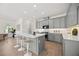 Modern kitchen with a center island, sleek countertops, and updated appliances at 9035 Duany Ln, Lakewood Ranch, FL 34240