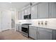 Kitchen showcases grey cabinets, stainless steel appliances, white countertops, and a subway tile backsplash at 9035 Duany Ln, Lakewood Ranch, FL 34240