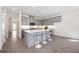 Modern kitchen featuring gray cabinets, white countertops, and a center island at 9035 Duany Ln, Lakewood Ranch, FL 34240
