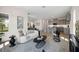 Open-concept living room with kitchen and dining areas and lots of natural light at 9035 Duany Ln, Lakewood Ranch, FL 34240