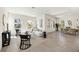 Bright and airy living room featuring modern decor, wood floors, and lots of natural light at 9035 Duany Ln, Lakewood Ranch, FL 34240