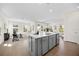 Open-concept living room with tile flooring, neutral walls, and modern furnishings at 9035 Duany Ln, Lakewood Ranch, FL 34240