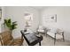 Bright office features natural light, a sleek desk, and modern decor at 9035 Duany Ln, Lakewood Ranch, FL 34240