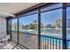 Spacious balcony offering captivating views of the pool, waterways, and surrounding beach community at 9200 Midnight Pass Rd # 24, Sarasota, FL 34242