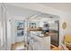 Modern kitchen with stainless steel appliances, granite countertops, and ample counter seating at 9200 Midnight Pass Rd # 24, Sarasota, FL 34242