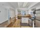 Modern kitchen features stainless steel appliances, granite countertops, and bar seating for casual dining at 9200 Midnight Pass Rd # 24, Sarasota, FL 34242