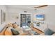 Inviting living area with water views, ceiling fan, and cozy decor perfect for relaxation and entertaining at 9200 Midnight Pass Rd # 24, Sarasota, FL 34242