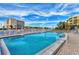 Inviting community pool with ample seating, offering scenic views and a refreshing retreat at 9200 Midnight Pass Rd # 24, Sarasota, FL 34242