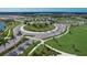Desirable community roundabout with lush greenery and palm trees offers easy navigation and aesthetic appeal at 10217 Canaveral Cir, Sarasota, FL 34241