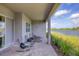 This covered back patio features lots of seating and unobstructed waterfront views at 10217 Canaveral Cir, Sarasota, FL 34241