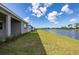 View of the backyard and the waterfront behind this home at 10217 Canaveral Cir, Sarasota, FL 34241
