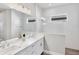 Bathroom with double sink vanity, white countertops and subway tile walls at 10217 Canaveral Cir, Sarasota, FL 34241