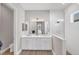 Spa-like bathroom featuring double vanity, walk-in shower, and stylish tile work at 10217 Canaveral Cir, Sarasota, FL 34241