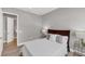 Comfortable bedroom with wood floors, side tables, and an ensuite bathroom at 10217 Canaveral Cir, Sarasota, FL 34241
