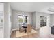 Cozy dining area with wicker chairs, wood flooring, and natural light at 10217 Canaveral Cir, Sarasota, FL 34241