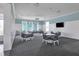 Bright game room featuring tables, chairs, and a pool table, perfect for entertainment and socializing at 10217 Canaveral Cir, Sarasota, FL 34241