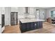 Open kitchen features stainless steel appliances, large kitchen island and breakfast nook at 10217 Canaveral Cir, Sarasota, FL 34241