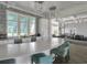 Modern kitchen with a quartz countertop, stainless steel appliances, and bar stool seating at 10217 Canaveral Cir, Sarasota, FL 34241