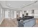 Open-concept living space shows tile floors, modern finishes and flow into kitchen and dining areas at 10217 Canaveral Cir, Sarasota, FL 34241