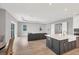 Open-concept living room featuring recessed lighting, wood floors, and neutral color palette at 10217 Canaveral Cir, Sarasota, FL 34241